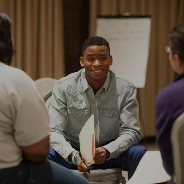 Three students in a peer counseling session.